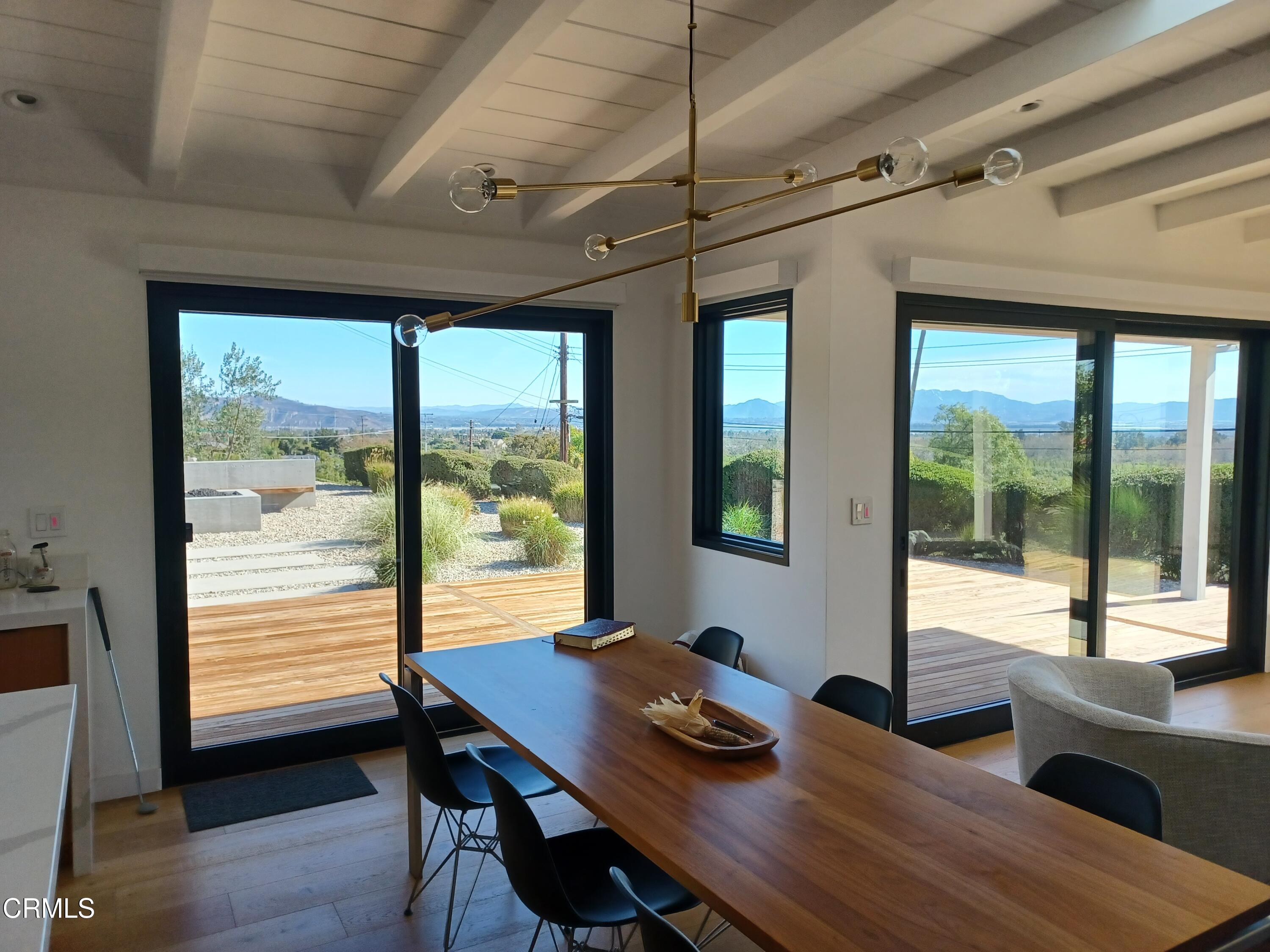 a view of a workspace with furniture and window