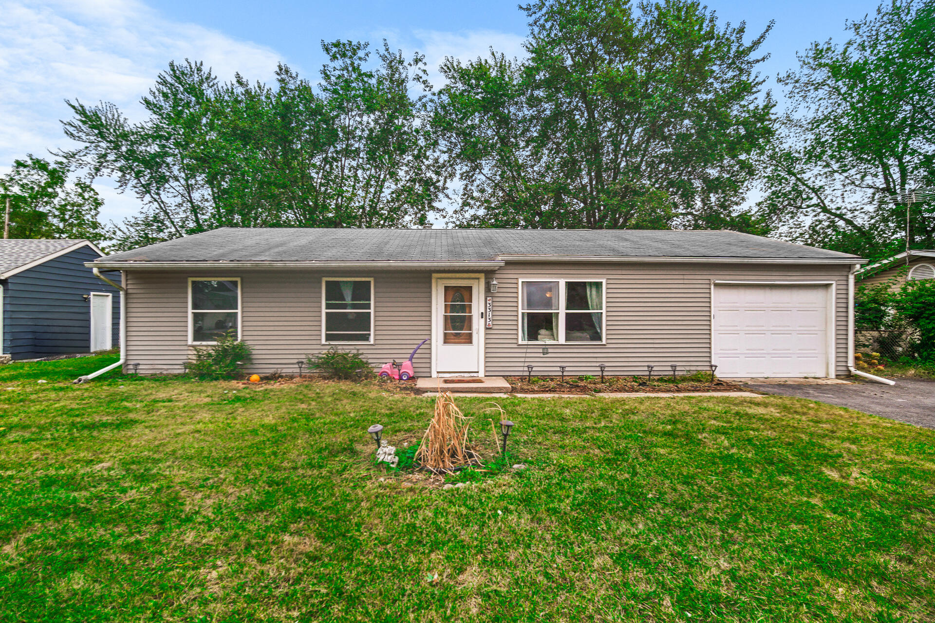 front view of a house with a yard