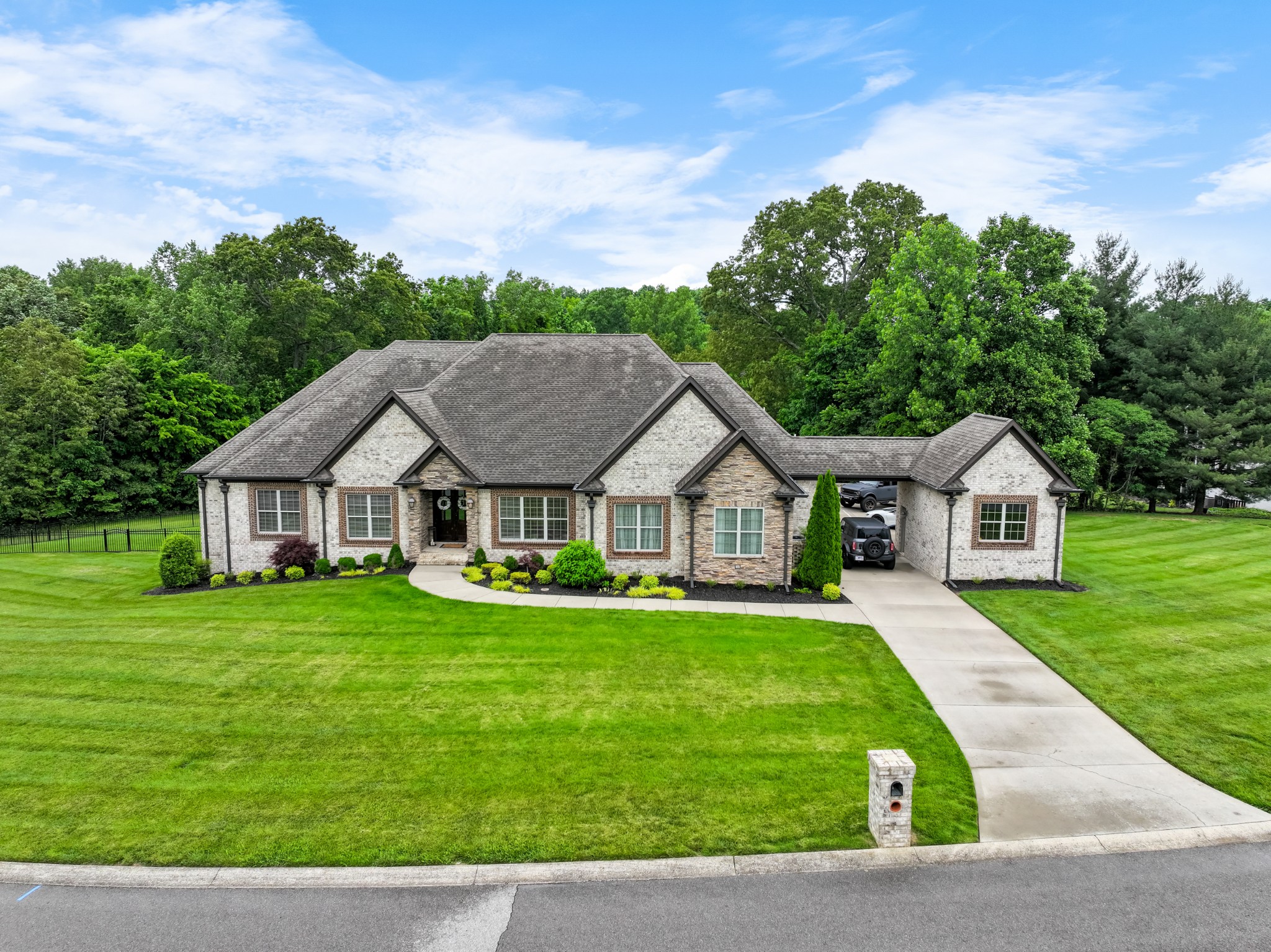 a front view of a house with a yard