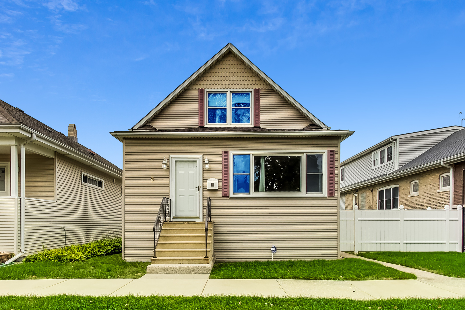 a front view of a house with a yard