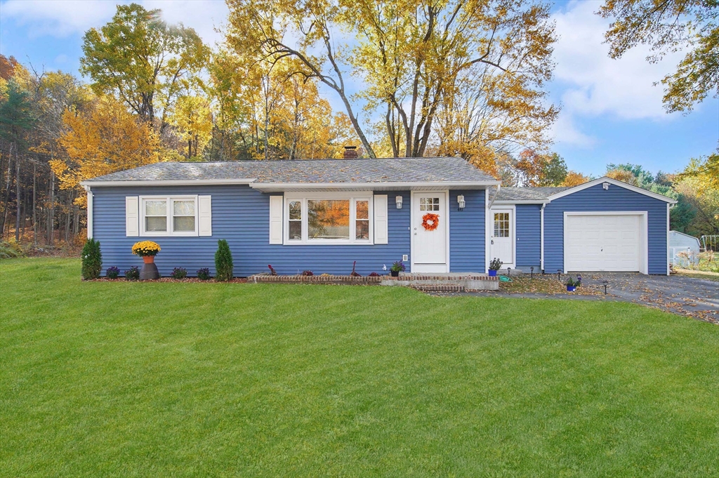 front view of a house with a yard