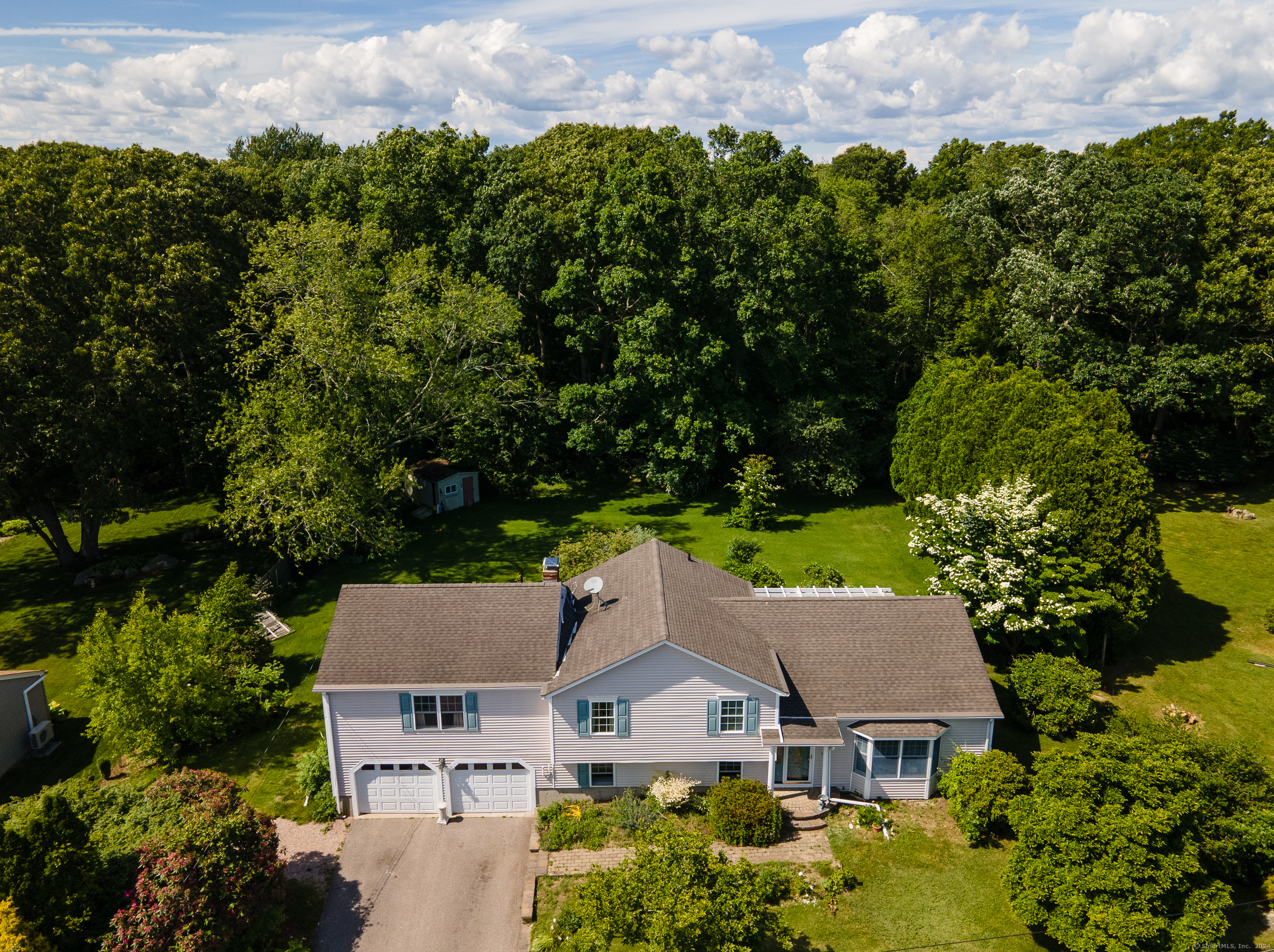 an aerial view of a house with a garden