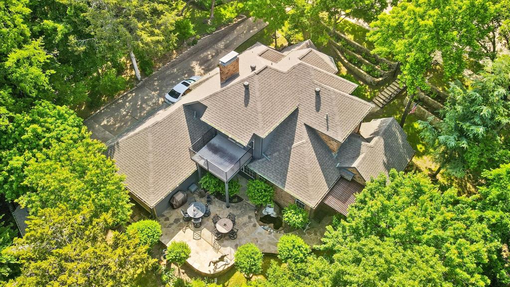 an aerial view of a house with outdoor space