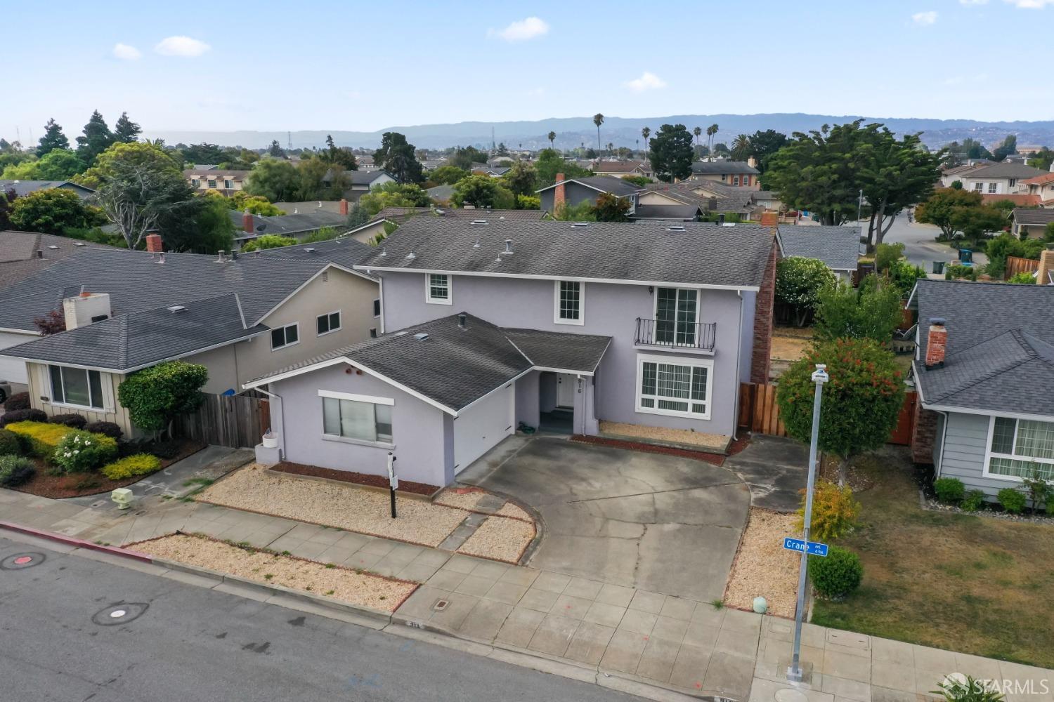 an aerial view of a house with a yard and garage