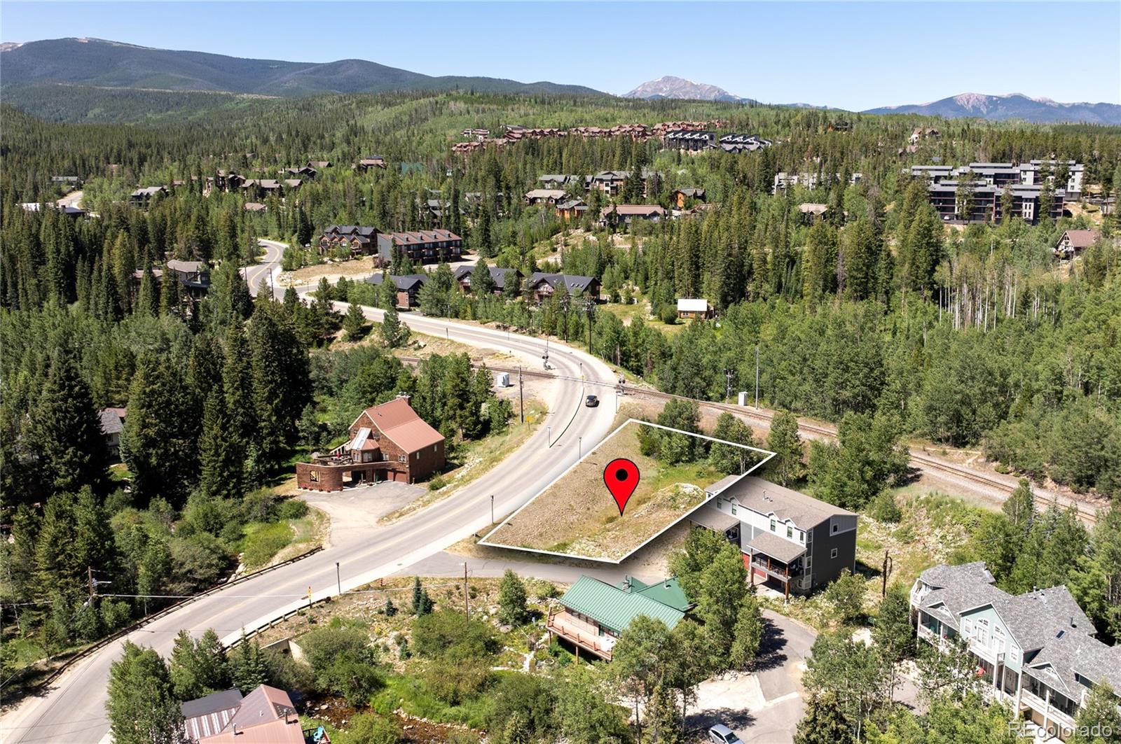 an aerial view of residential houses and outdoor space