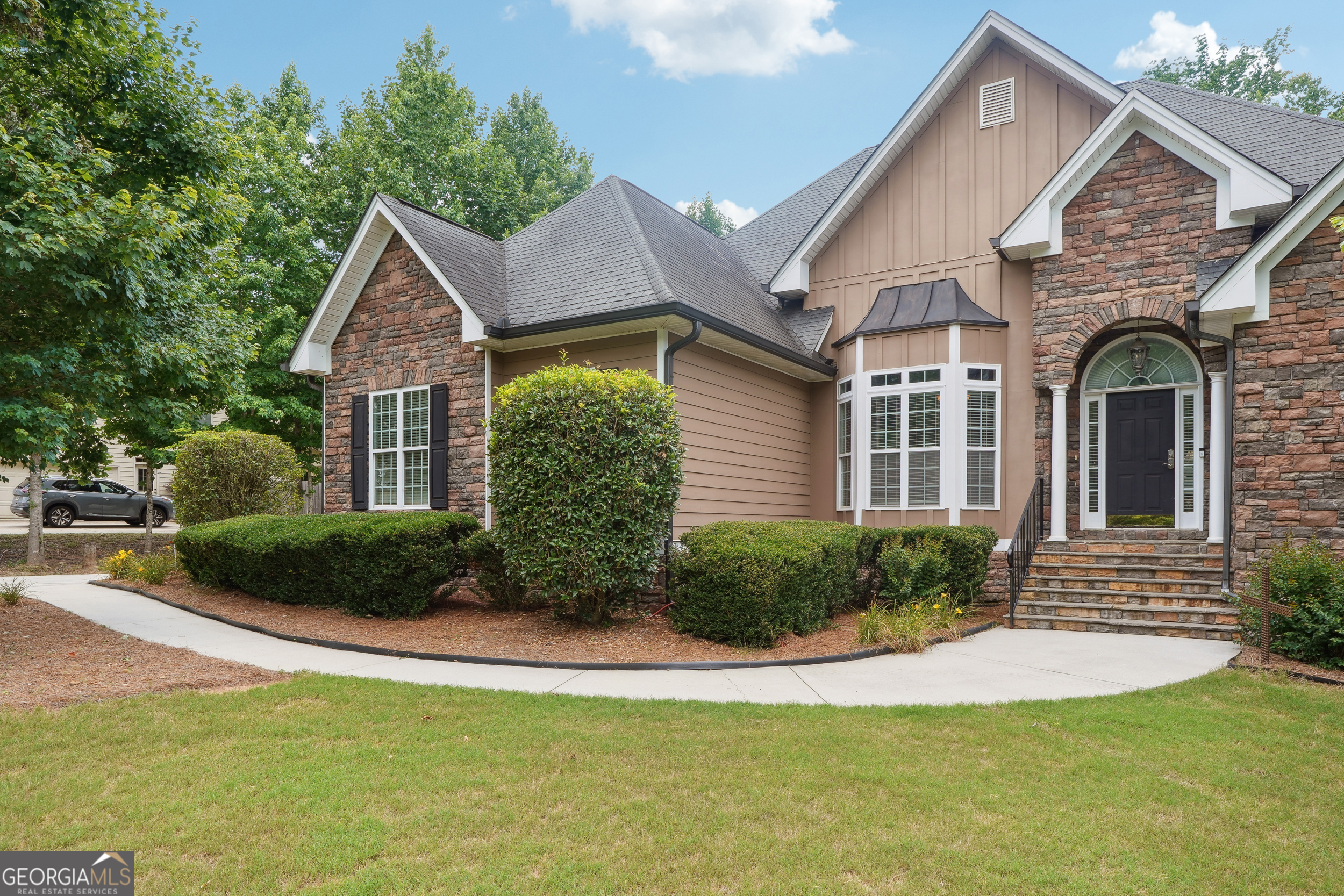 a front view of a house with a yard