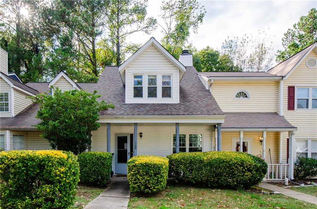 front view of a house with a yard