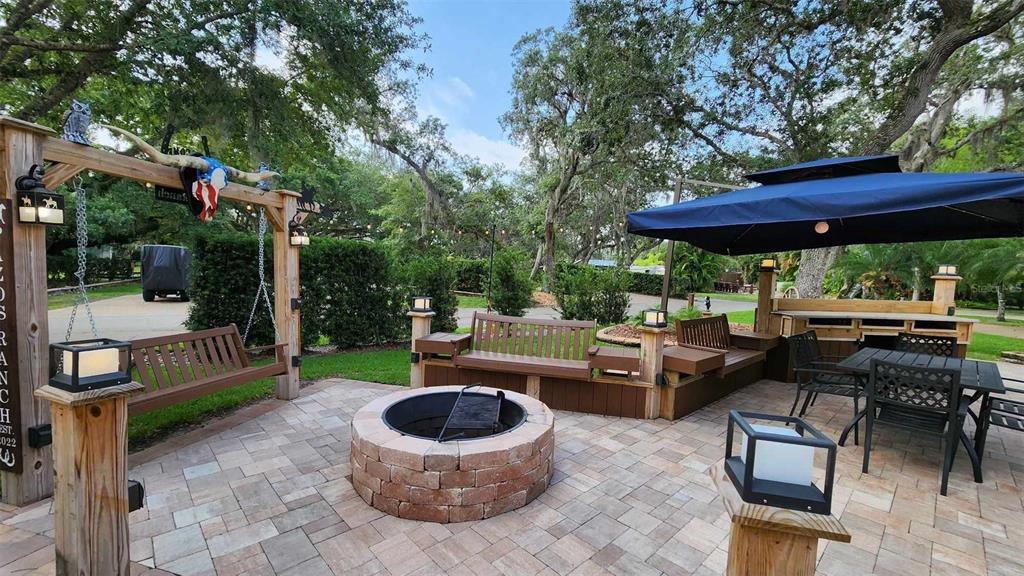 a view of yard with patio and outdoor seating