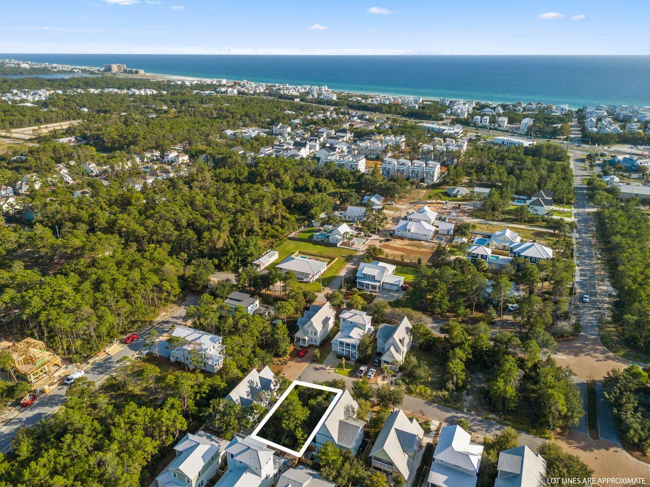 an aerial view of residential houses with city view