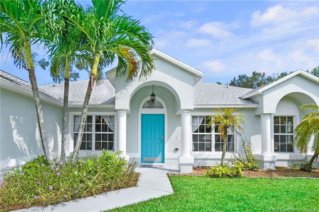 front view of a house with a garden