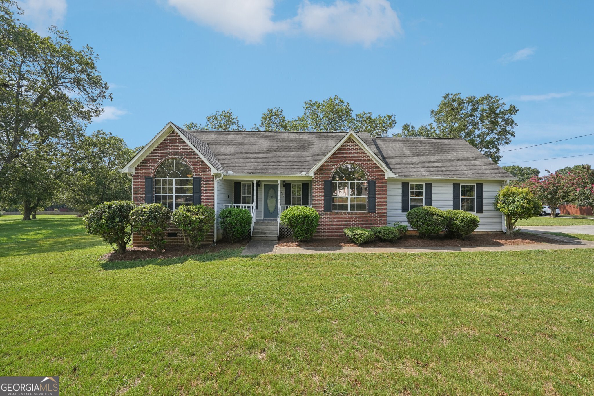 a front view of a house with a yard