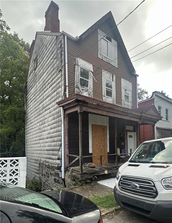 a front view of a house with parking space