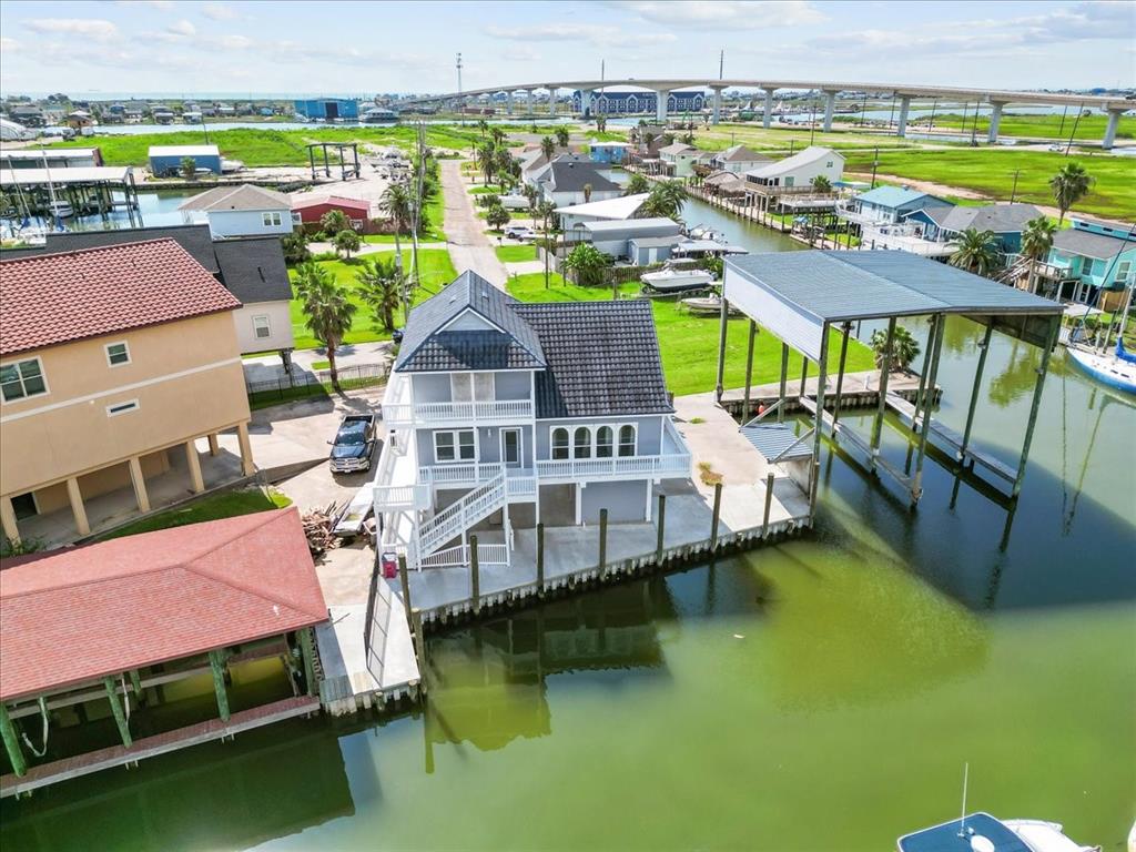 an aerial view of a house with a ocean view