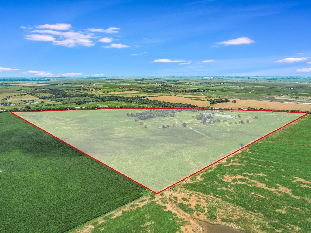 72+ acres with farmhouse and barn