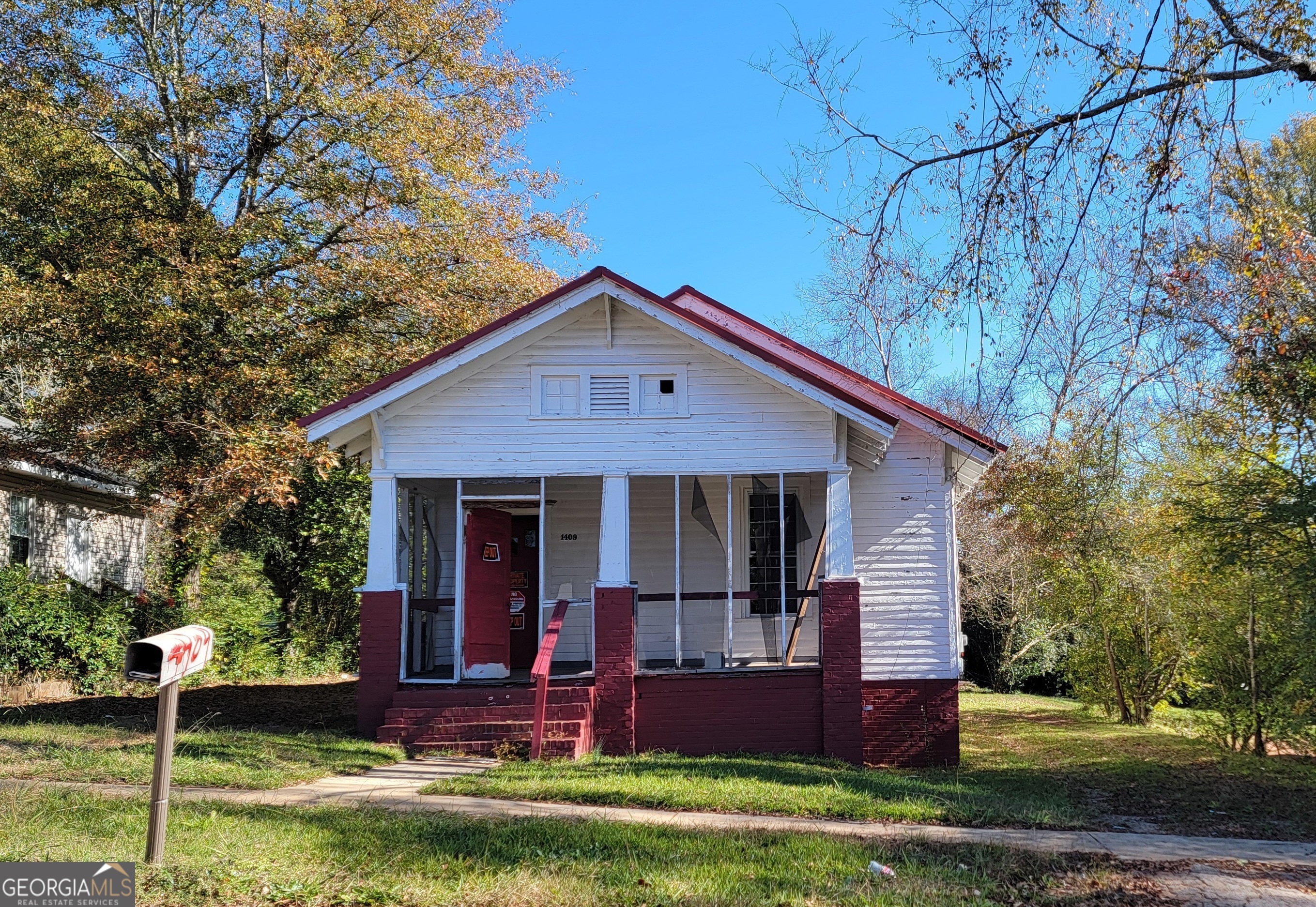 a view of house with yard