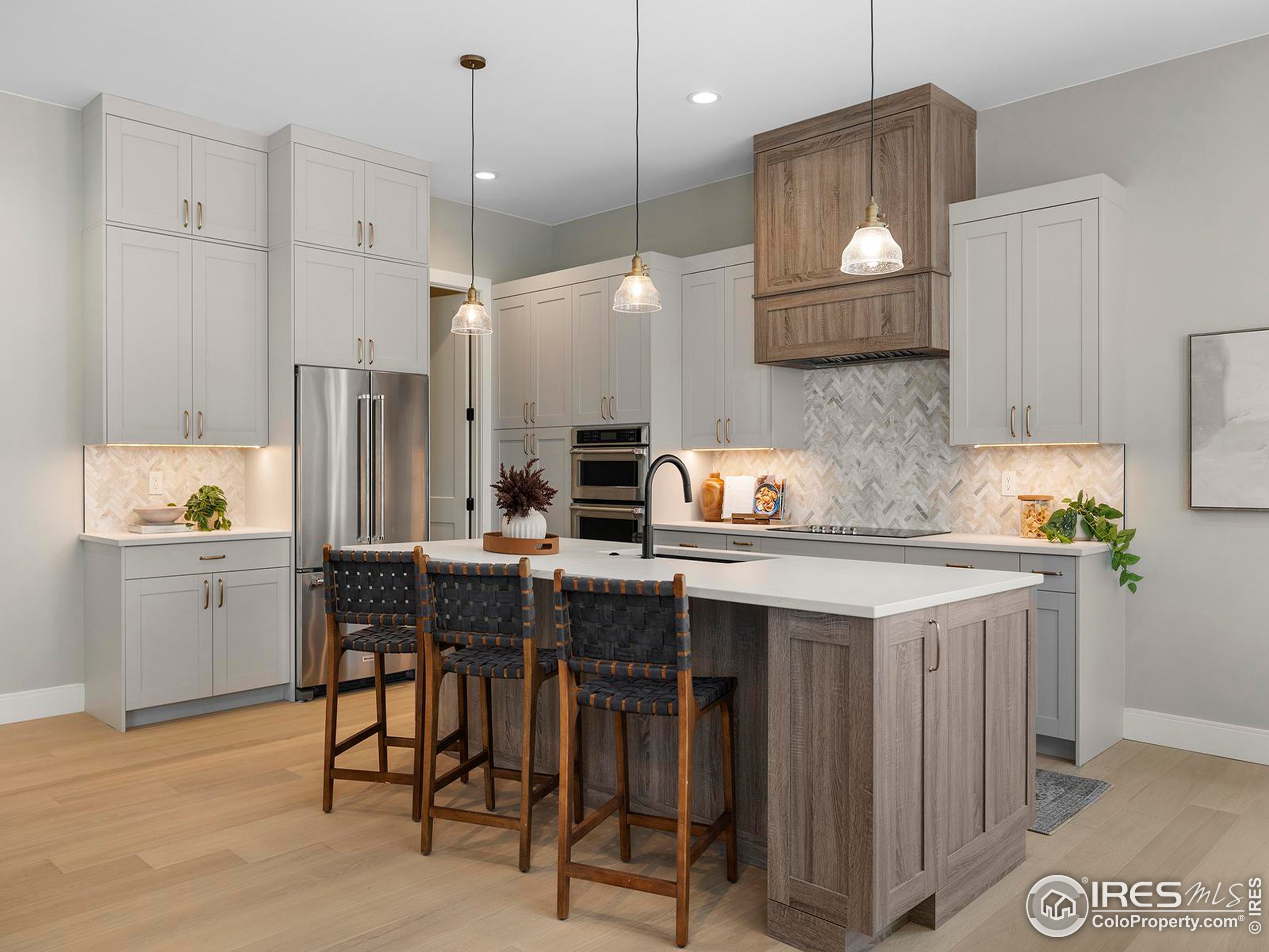 a kitchen with a sink cabinets and window