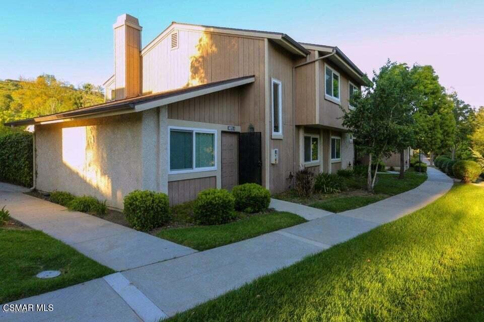 a view of a house with a yard