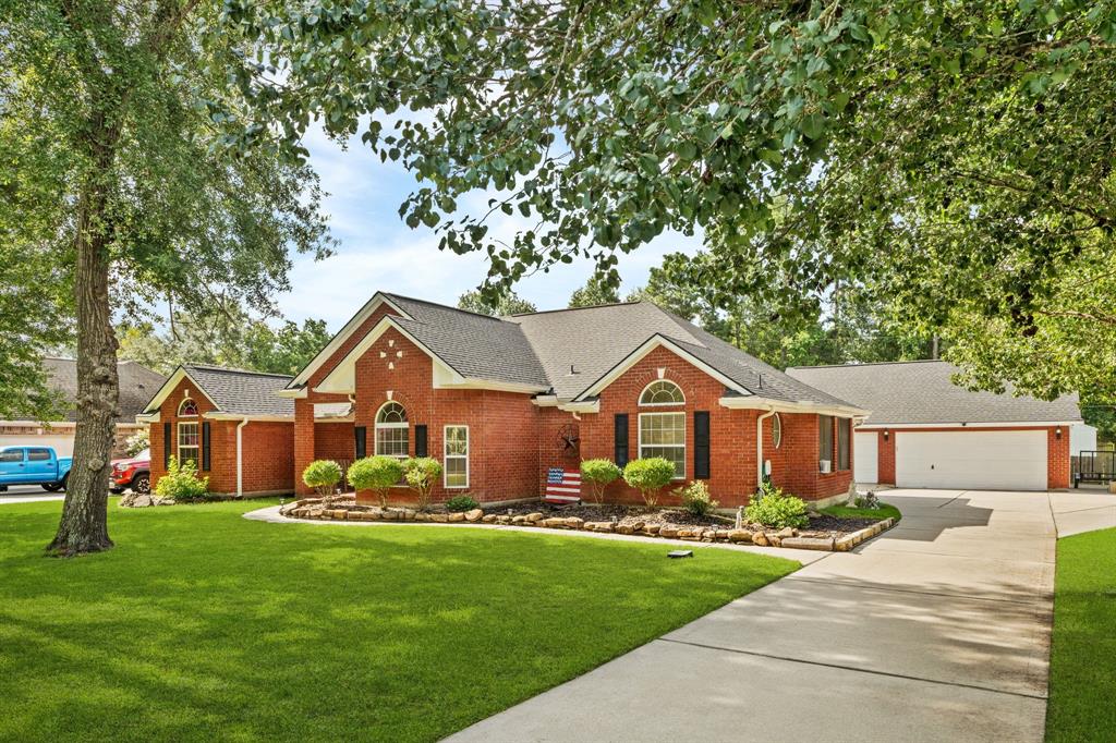 a front view of house with yard and green space