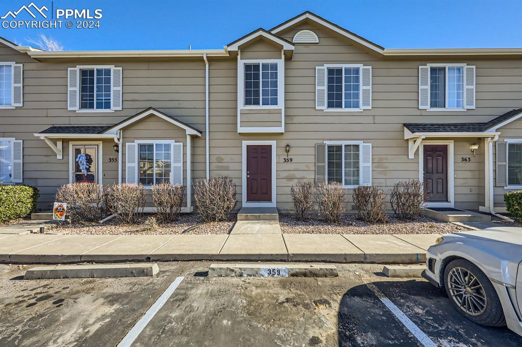 a front view of a house with parking space