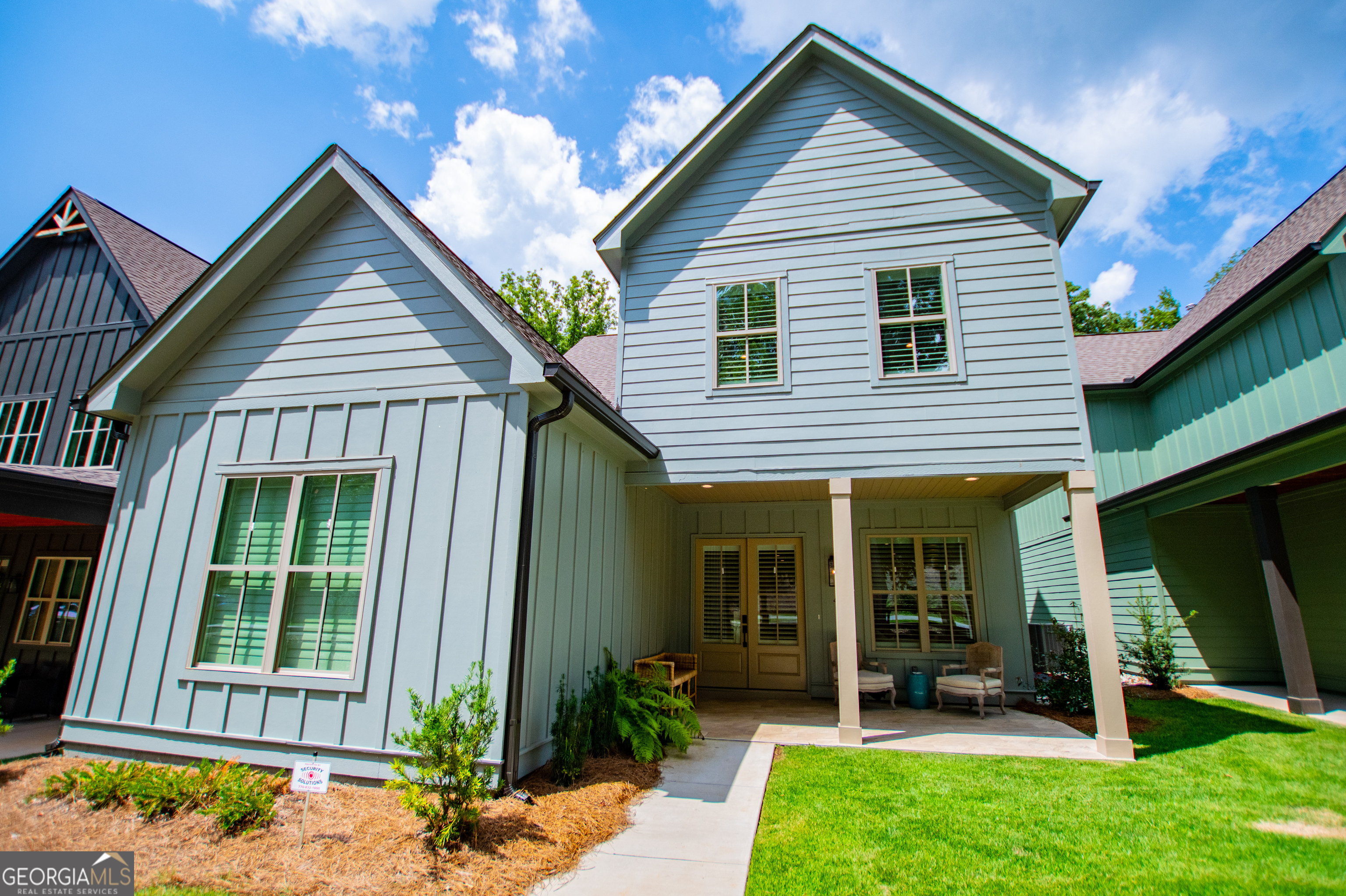 a front view of a house with a yard