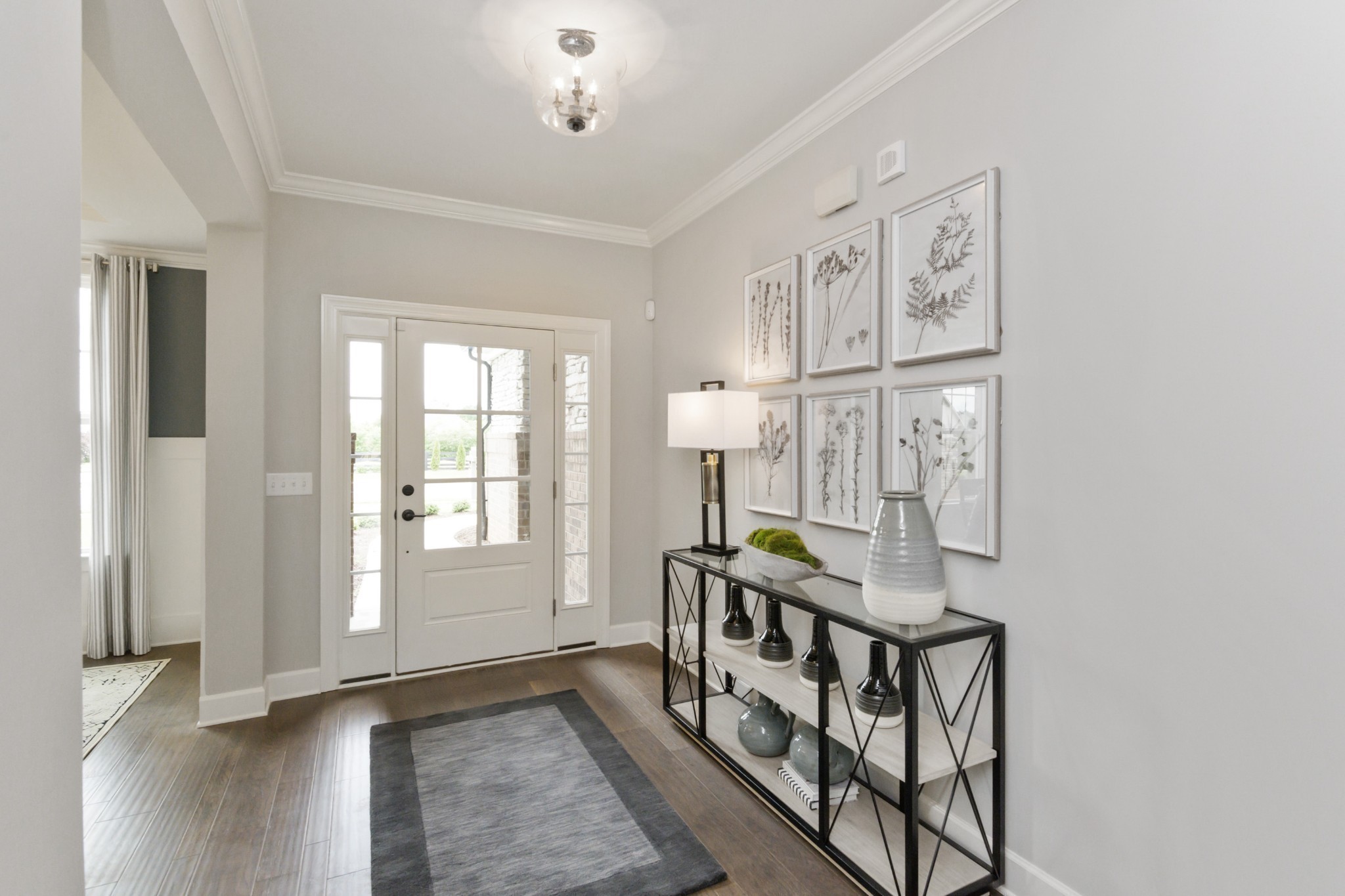 a view of an entryway with wooden floor