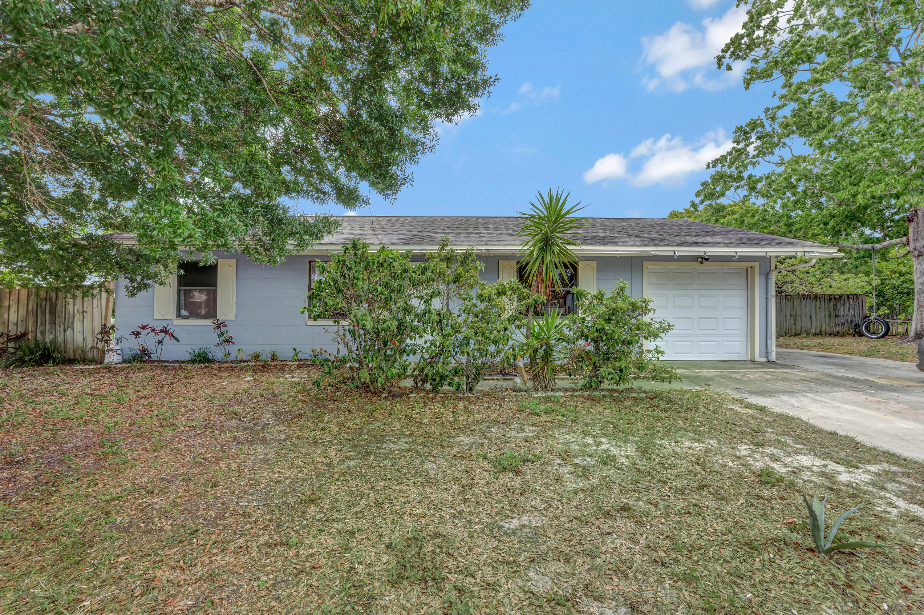 front view of a house with a yard