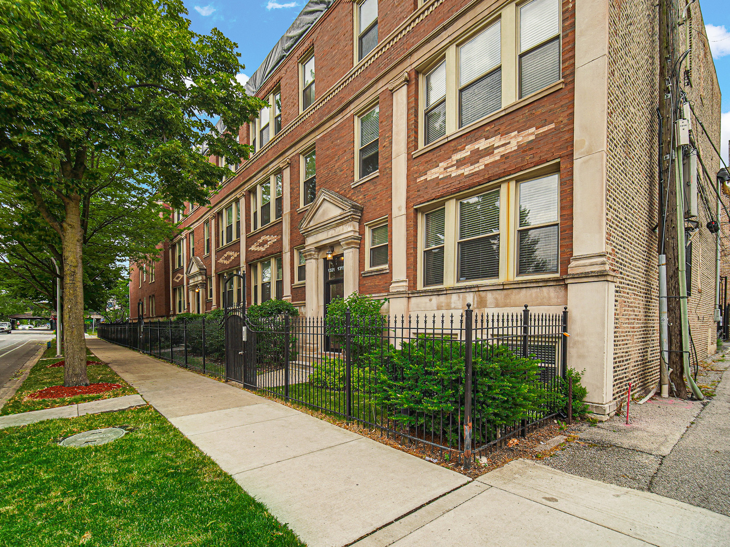 a view of a building with a yard