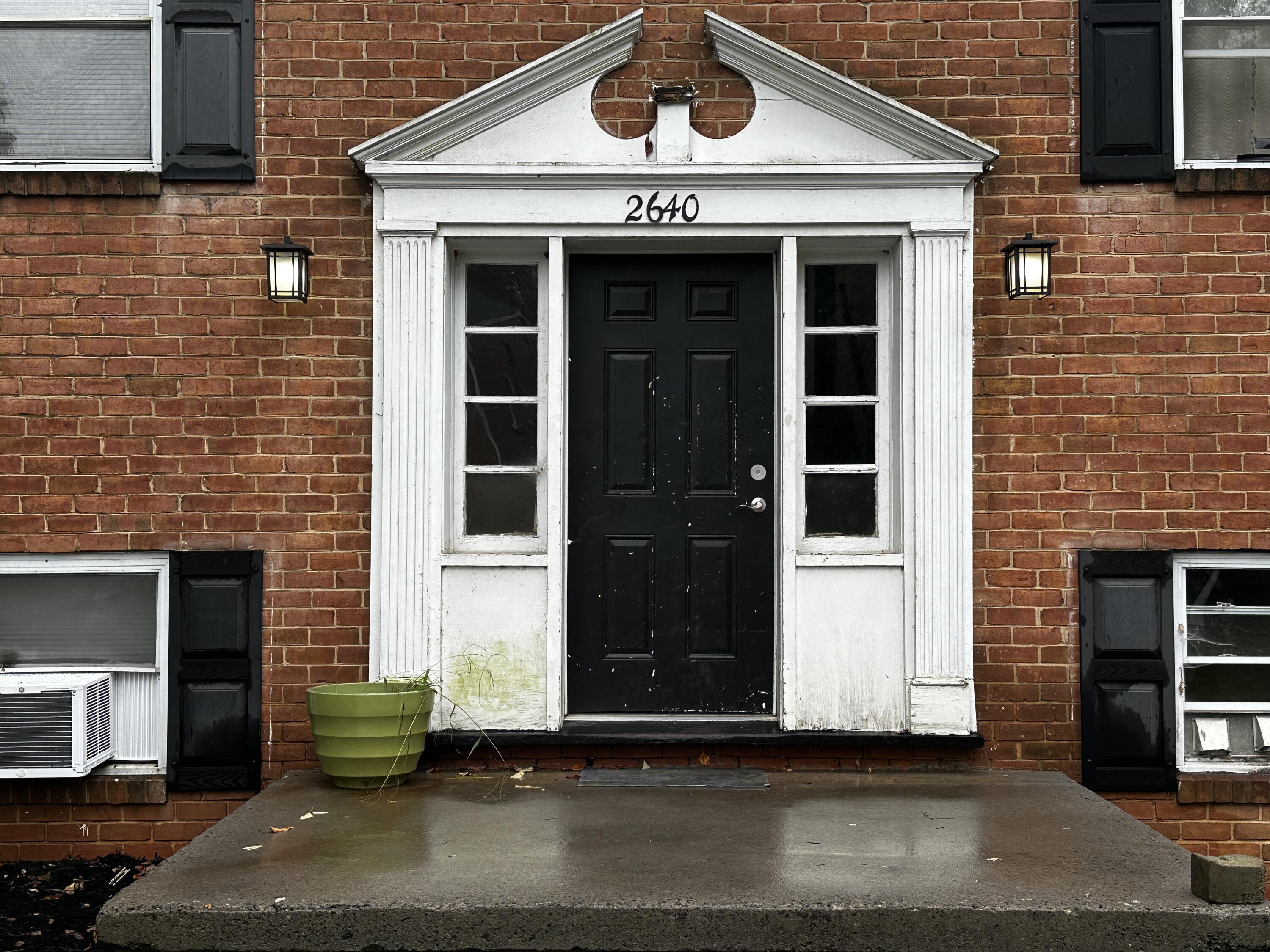 a front view of a house with a garage