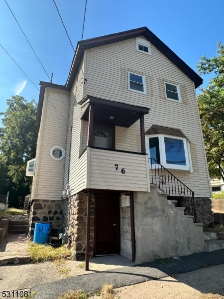 a front view of a house with garage