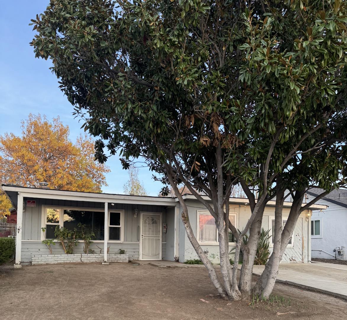 a house with trees in front of it