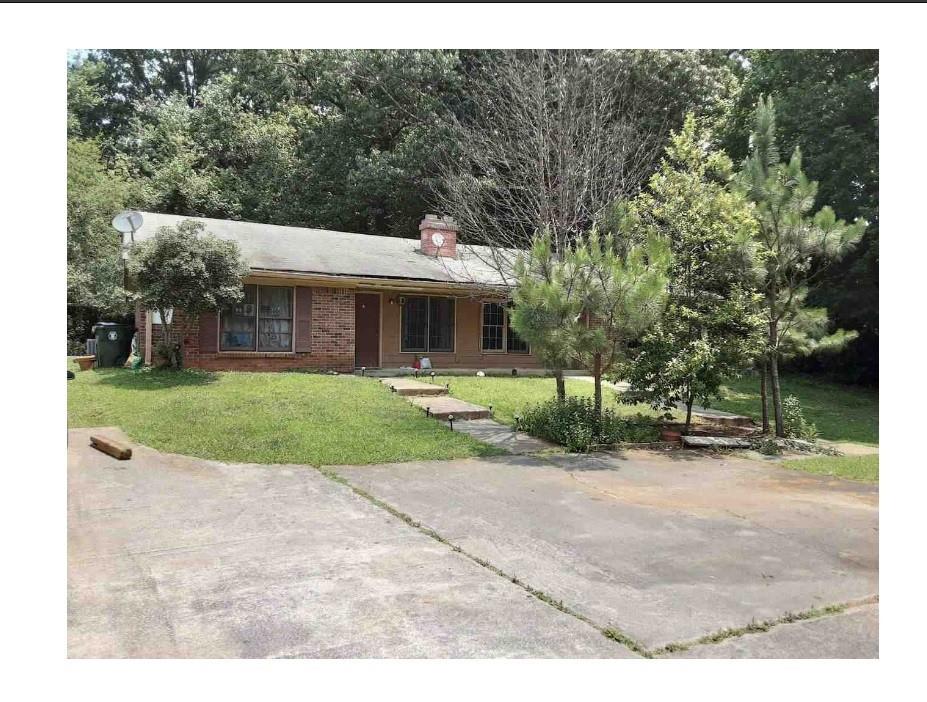 a view of house in front of house with yard