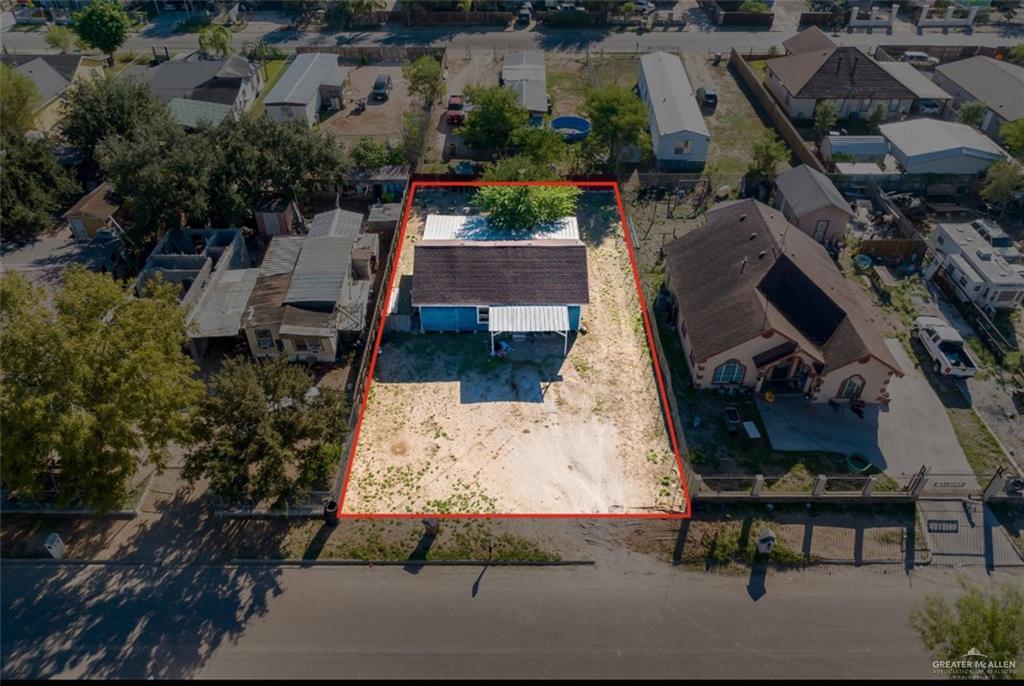 an aerial view of houses with outdoor space