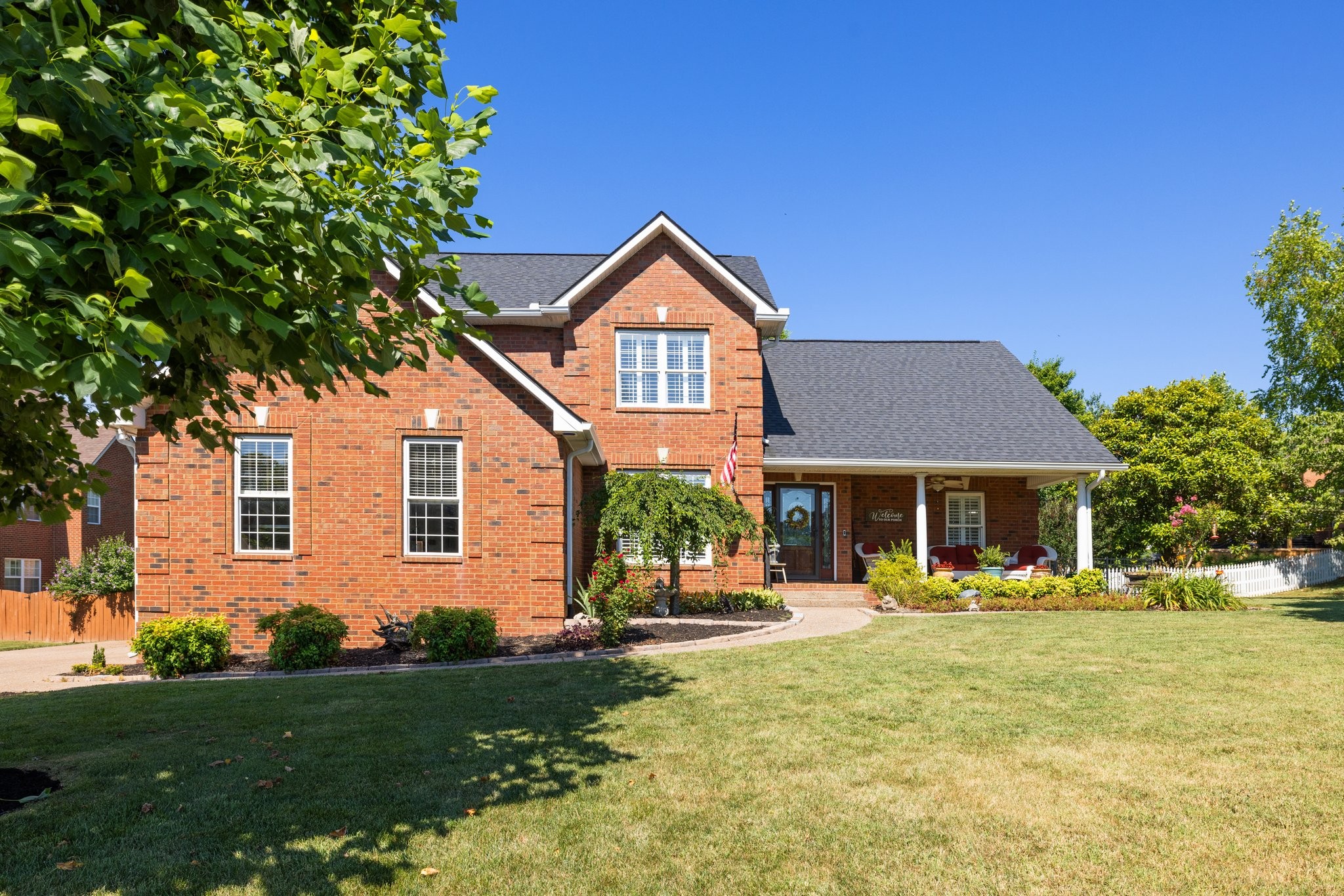 a front view of a house with a yard