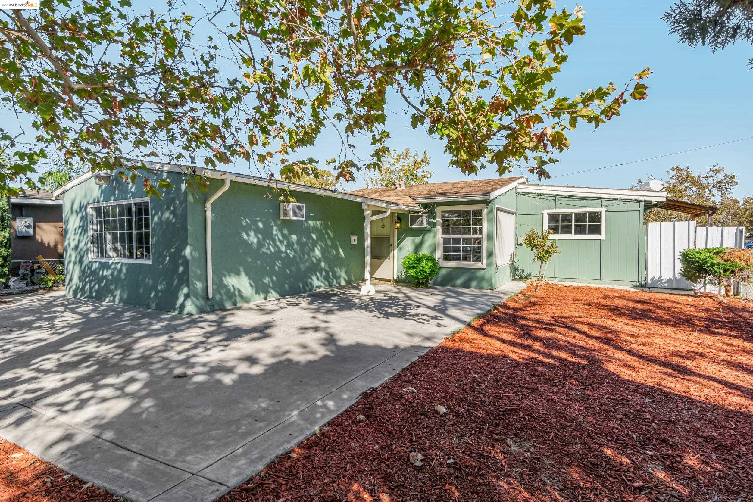 a house with a tree in front of it