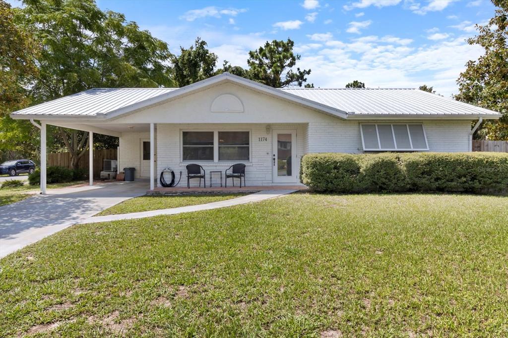 front view of a house with a patio