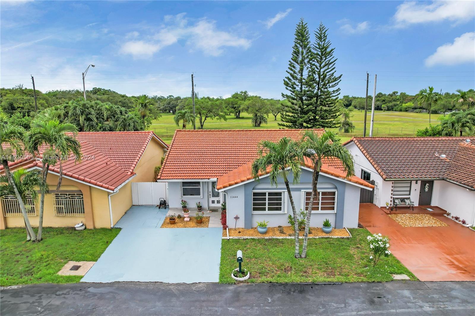 a aerial view of a house with a yard and garage