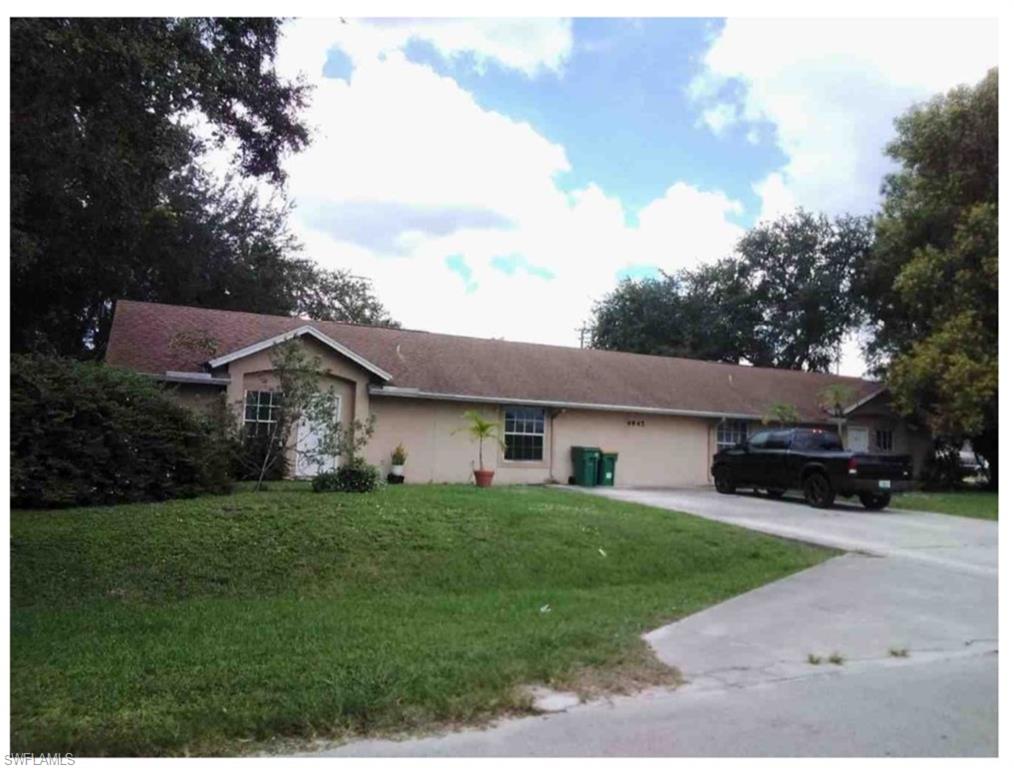 Ranch-style home featuring driveway and front lawn