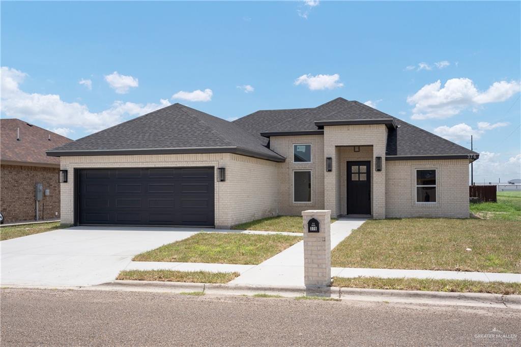 a front view of a house with yard