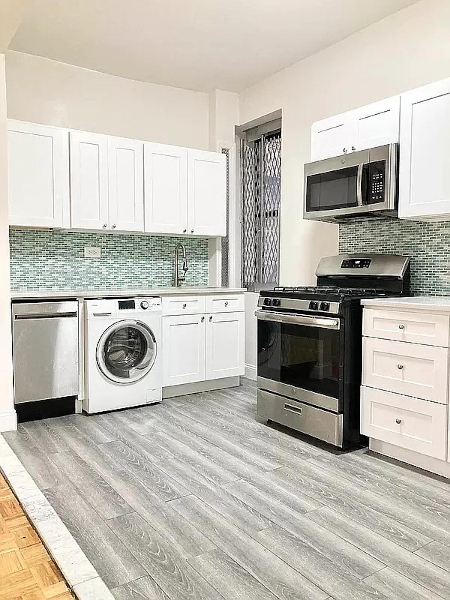 a kitchen with a stove and a microwave