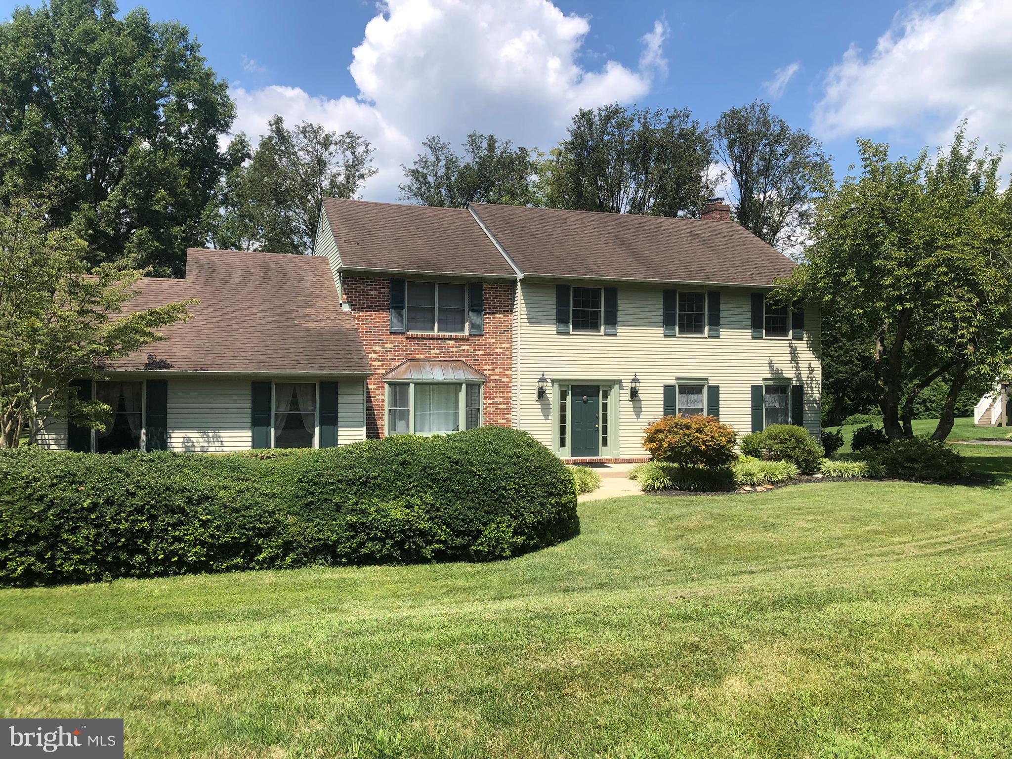 a view of a house with a yard and plants