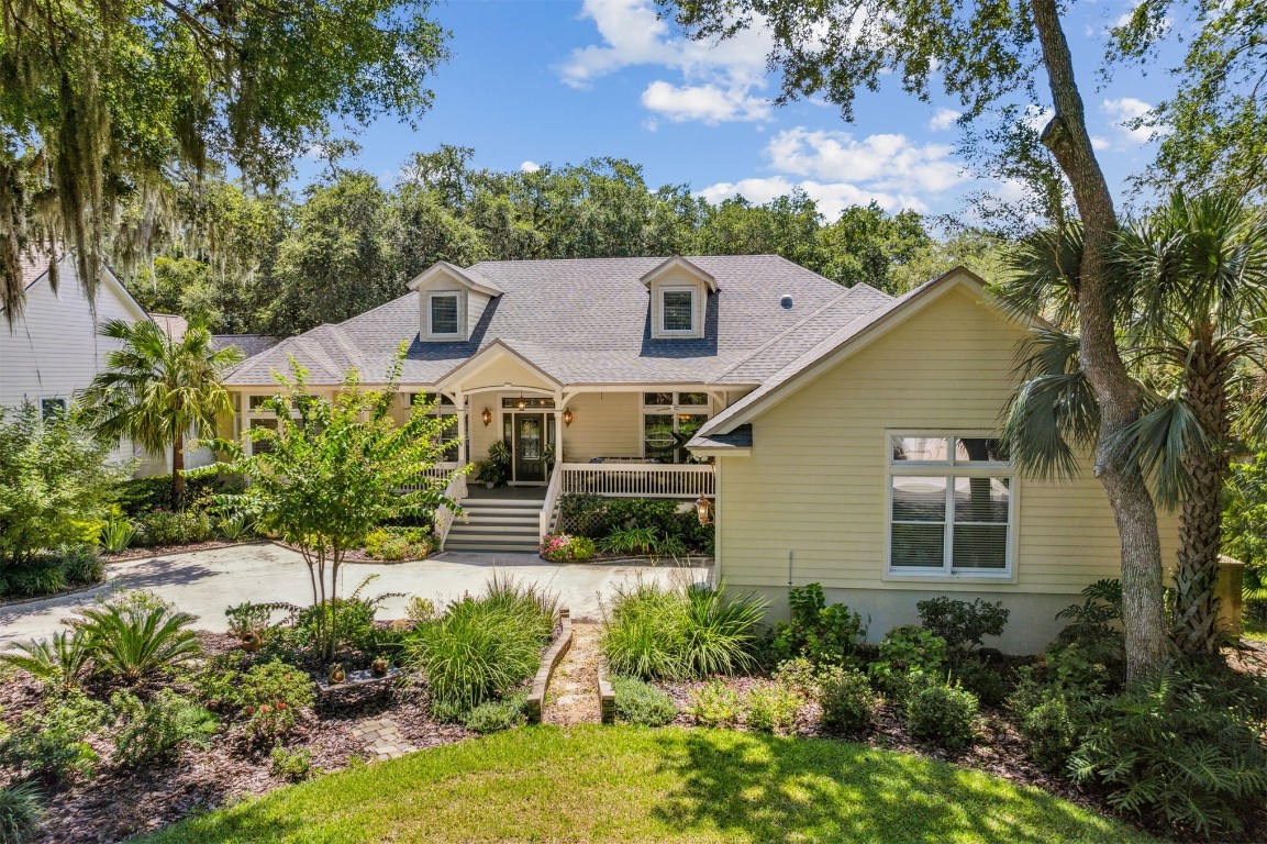 a aerial view of a house with a yard