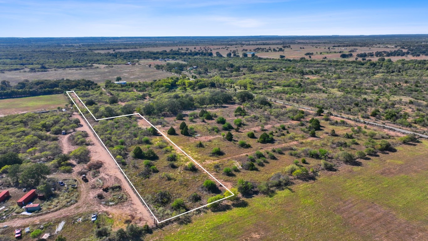 an aerial view of house with yard