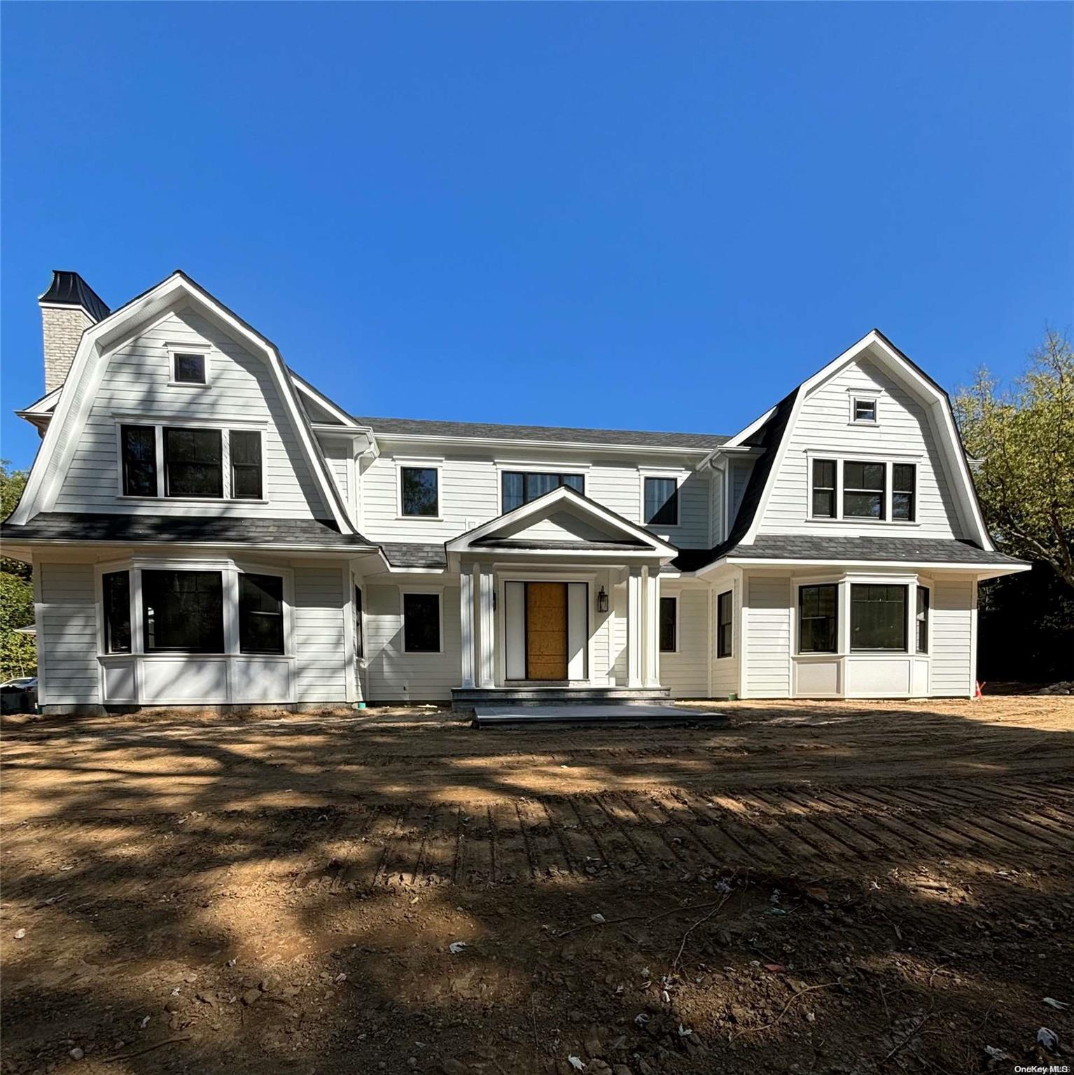 a front view of a house with a ocean view