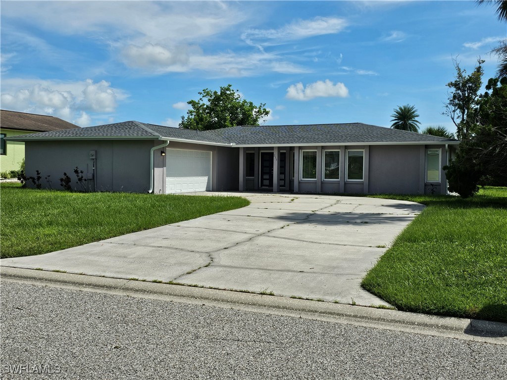 front view of a house with a yard