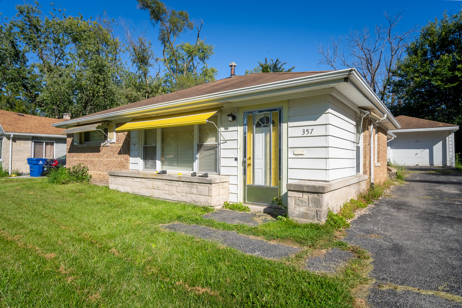 a view of house with backyard porch and garden