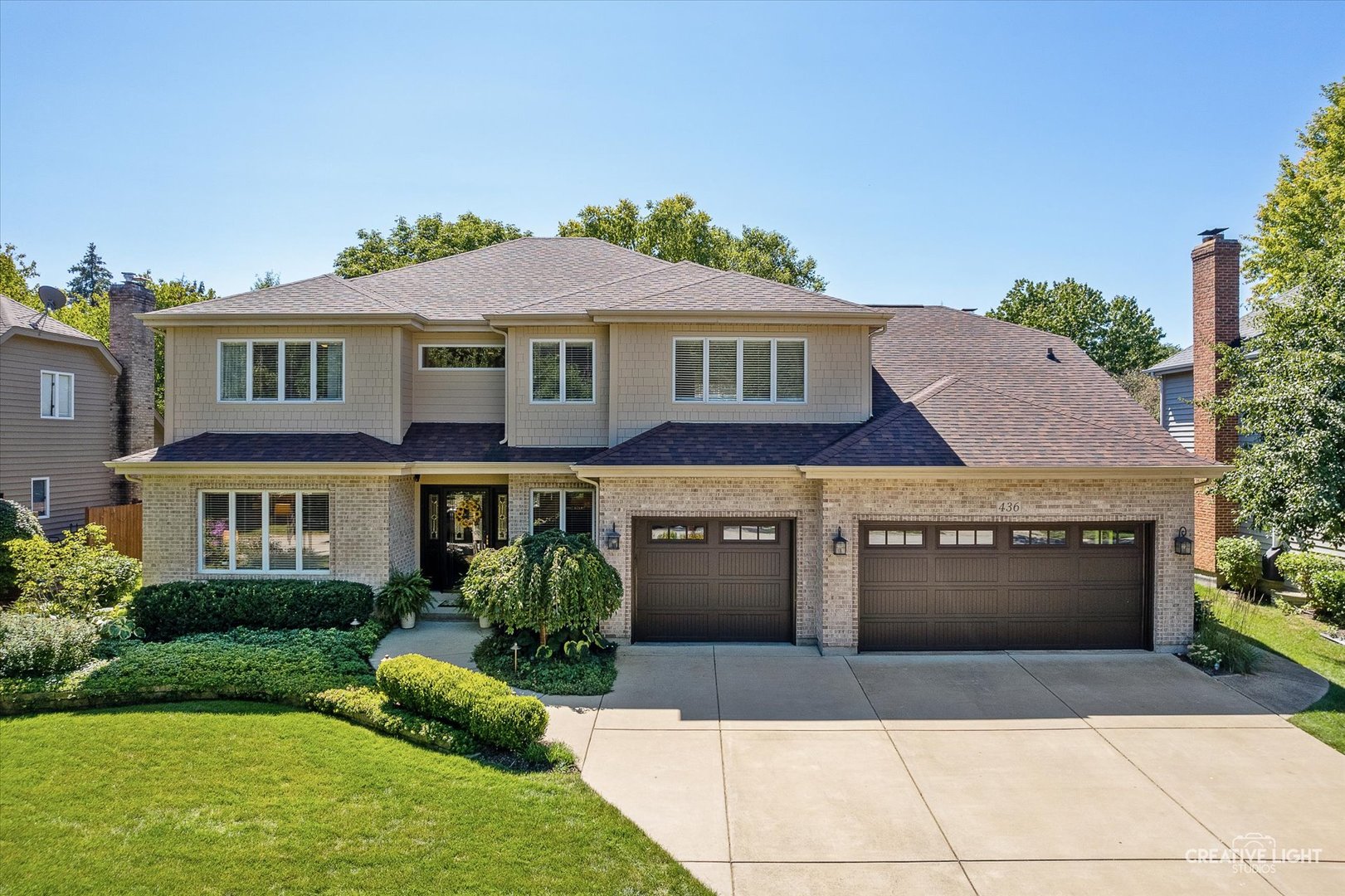 a front view of a house with yard