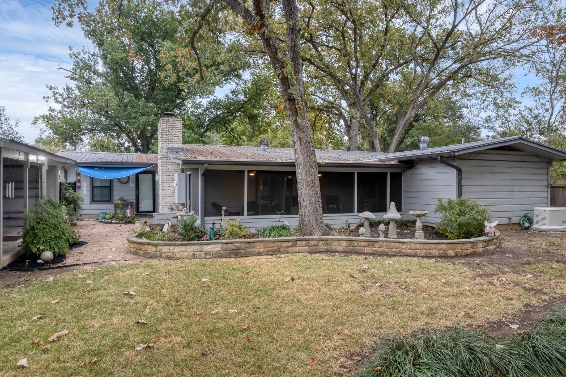 a front view of house with yard and seating space