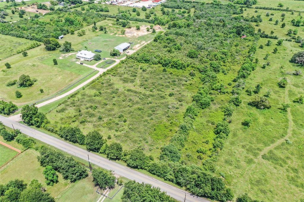 Welcome to Bois D' Arc Lane adjacent to 8518 Bois D' Arc. This section of the total 18.828 acres includes a barn.