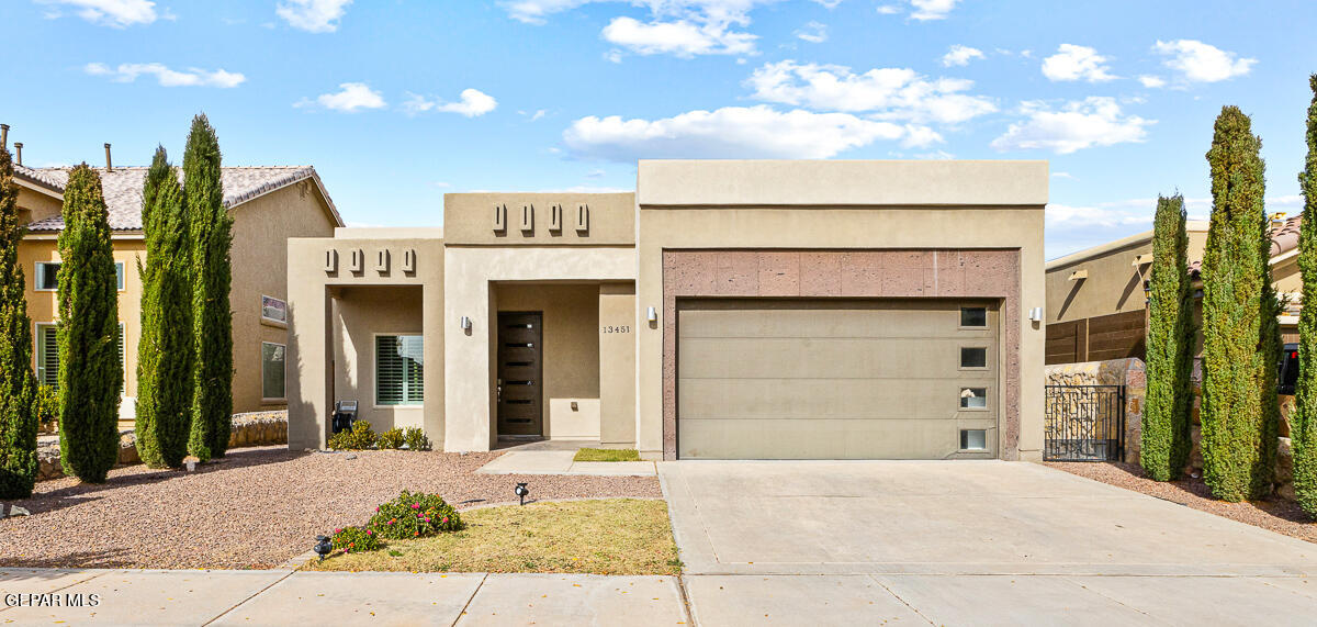 a front view of a house with a garage