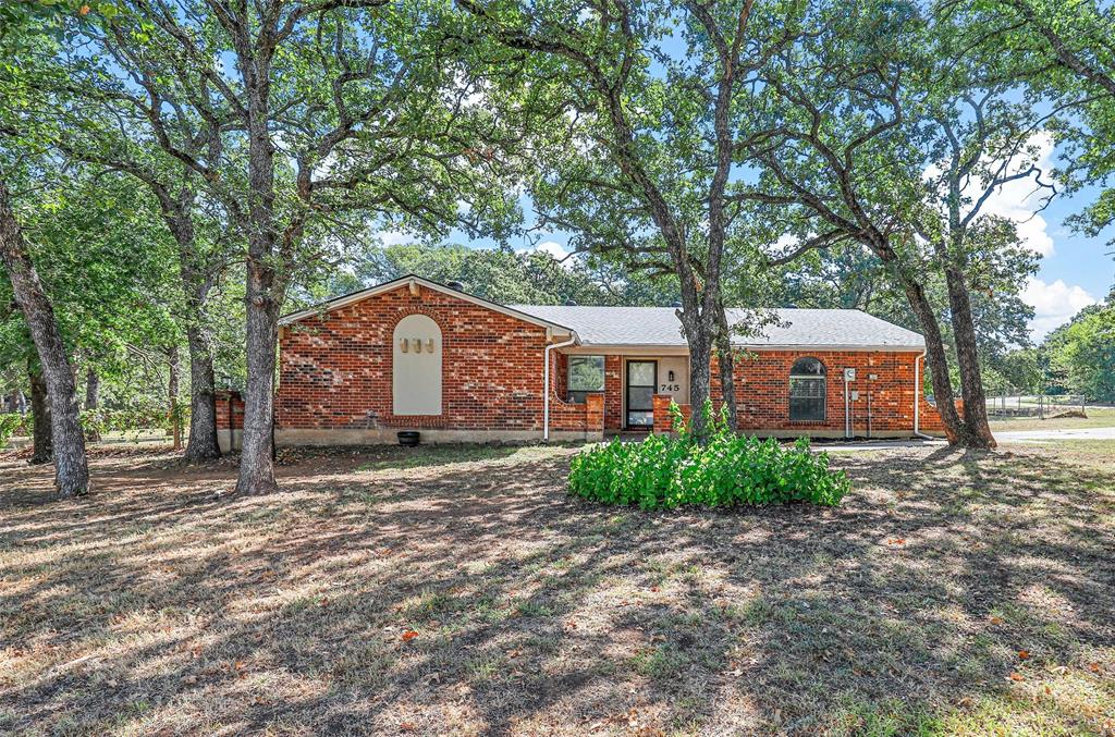 a house with trees in front of it